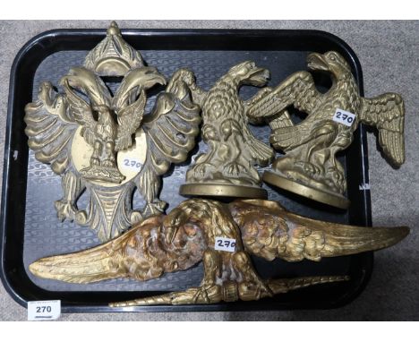 A pair of brass eagle bookends, an eagle door knocker and an ormolu eagle mount Condition Report: Not available for this lot