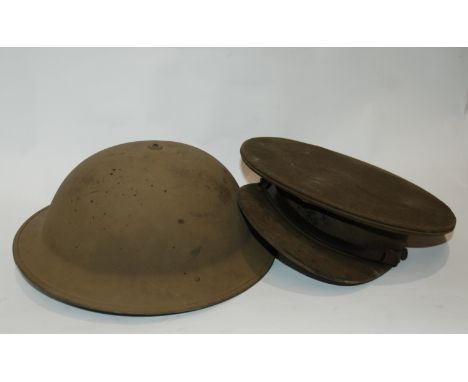 An army helmet and cap, etc Provenance: The Late Dr Helen. E. C. Cargill Thompson Condition Report: Available upon request