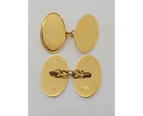A pair of 18ct cufflinks, blank one side with engine turned engraved pattern on the other weight 9.9gms Condition Report: Ava