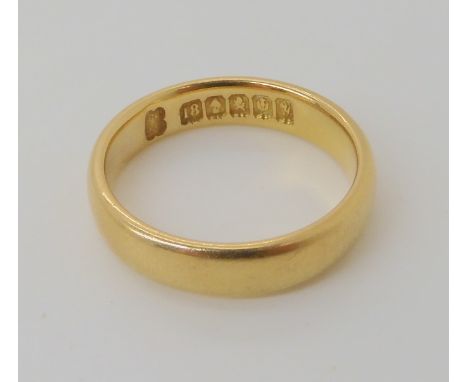 An 18ct gold Glasgow hallmarked court wedding band size P1/2, weight 6.4gms Condition Report: Lovely deep crisp hallmarks, no