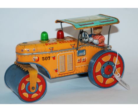 A Japanese tinplate road roller by Modern Toys, 26cm wide Condition Report: Available upon request