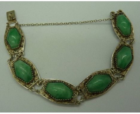 A silver and jade bracelet