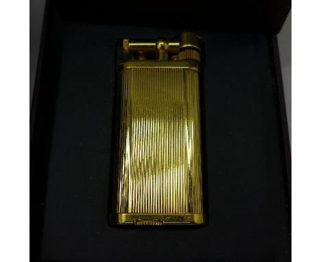 A Dunhill lighter with box and papers
