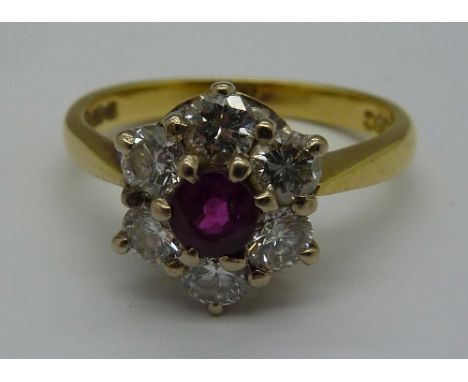 An 18ct gold, diamond and ruby cluster ring, weight 3.9g, size M