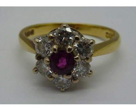 An 18ct gold, diamond and ruby cluster ring, weight 3.9g, size M