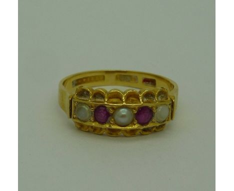 An 18ct gold, ruby and pearl ring, weight 3.1g, size M