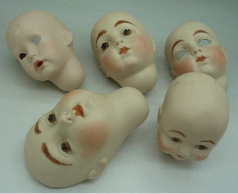 Five bisque dolls heads, a/f