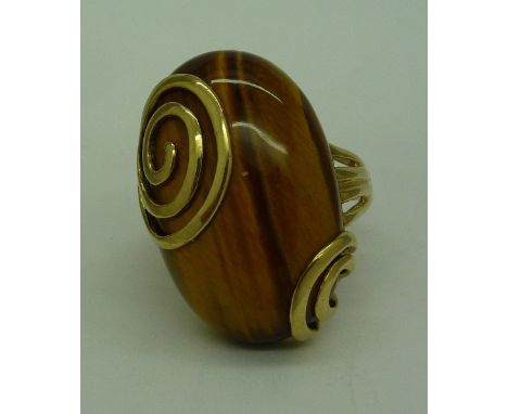 A large 9ct gold and tigers eye ring, weight 11g, size T, stone approximately 27mm x 17mm