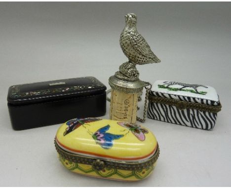 A papier mache tobacco box, two trinket boxes and a bottle stopper