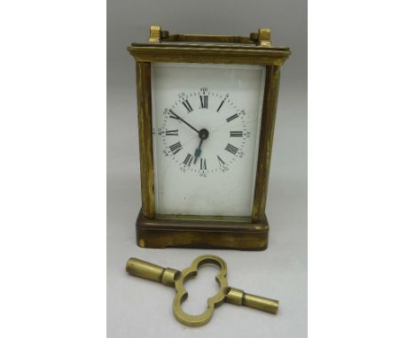 A brass carriage clock, dial a/f, height of case 11cm
