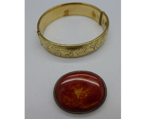 A Charles Horner silver and Ruskin style stone set brooch and a 9ct metal core bangle