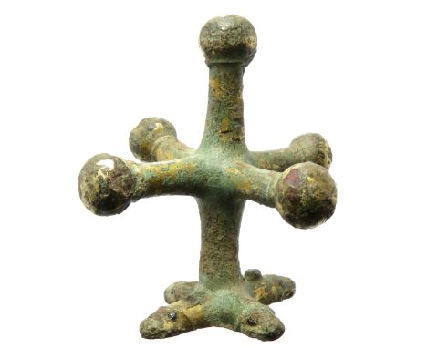 Medieval gilt bronze terminal or mount. The mount is three-dimensional and in the form of a quatrefoil set on a vertical shan