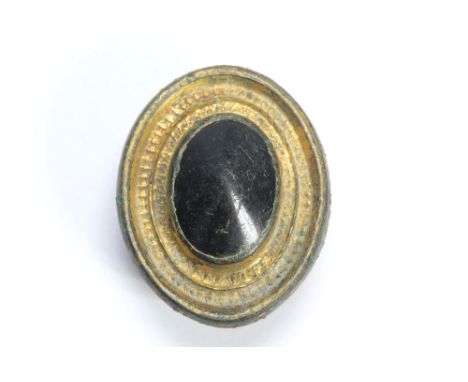 Roman gilt bronze centre boss brooch. Circa 200-300 CE. A large oval brooch with heavily gilt surfaces and a large conical bl
