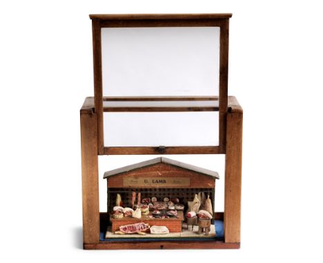 Butcher’s Shop Diorama - A rare antique butcher’s shop diorama with its original signage “U. Lamb” and “Family Butcher” c.190