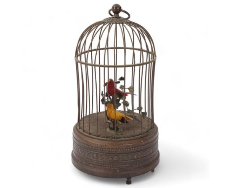 Bird -in-a-cage automaton, early 20th century, brass wirework cage with musical mechanism, height 27cmDusty and tarnished but