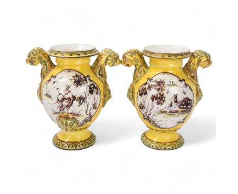 Pair of early 19th century Italian Maiolica jars, decorated with manganese yellow and copper green, each with panels depictin