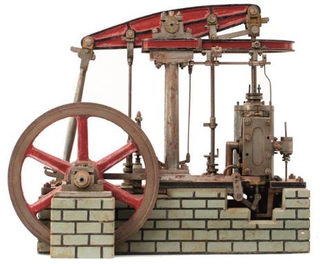 AN INTERESTING SCRATCH BUILT MODEL OF A LIVE STEAM BEAM ENGINE, with red and green painted details, on a painted wooden faux 