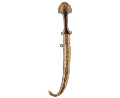 A MOROCCAN JAMBIYA, 23cm curved clipped back blade, characteristic brass mounted hilt decorated with panels of foliage, plain