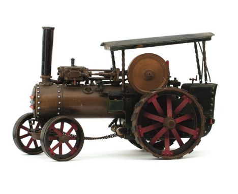 A SCRATCH BUILT MODEL LIVE STEAM ENGINE, painted in green, red and black livery, 17cm high (to top of chimney). (Sold unteste