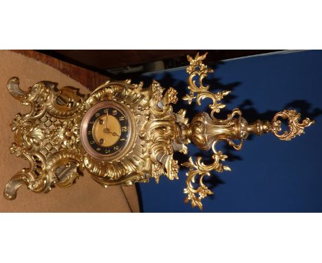 Elaborate brass cased mantle clock with black enamel dial 