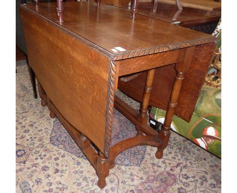 Light oak drop leaf gate leg table on turned supports 