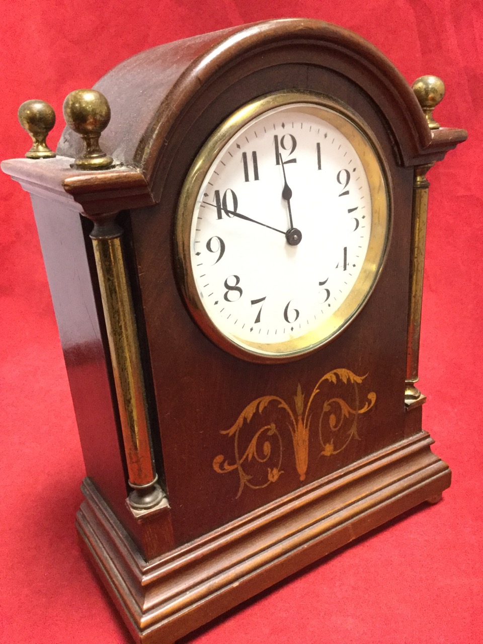 An Edwardian Mahogany Mantle Clock, The Domed Case With Brass Corner 