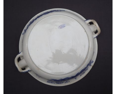 A Swansea Ladies of Llangollen pattern plate warmer together with another blue and white pottery plate warmer in the Abbey ru