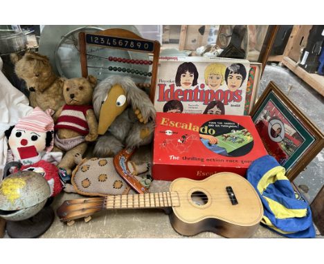 Teddy bears together with an abacus, ukelele, Escalado game, Identipops, Wales mirror etc 