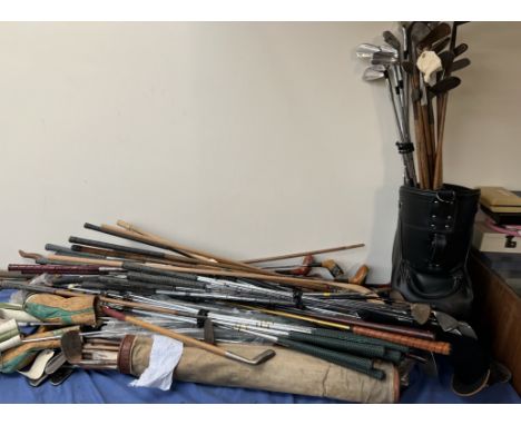 A large quantity of vintage and more modern golf clubs and golf bags etc including a jade putter, maxwell putting cleek, Wils