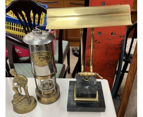 An E. Thomas &amp; Williams brass and steel miner's lamp together with a brass figure of a miner and a desk lamp