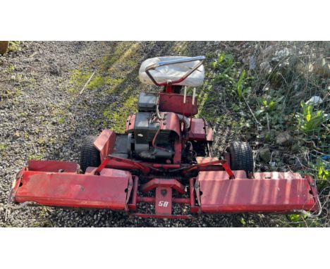 A ride on lawn mower with three wheels and Briggs and Stratton engine (Sold for spares)