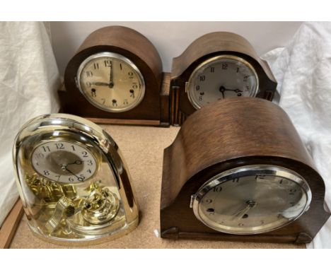 An anniversary clock together with three oak cased mantle clocks 