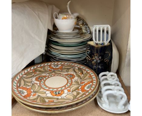 A pair of Charlotte Rhead pottery chargers decorated with flowers and leaves together with various plates, Crown Devon twin h