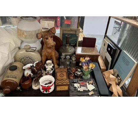 A puzzle box together with cruet bottles, stoneware bottles, lamp shades, carved dog etc 
