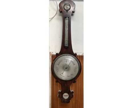 A Victorian rosewood banjo barometer with a hydrometer to the top, the circular silvered dial with central sun motif, the bas