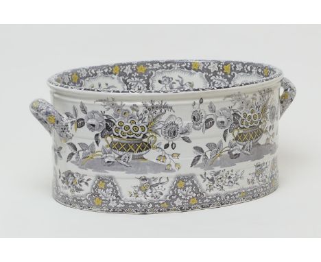 Spode printware footbath, circa 1820-40, twin handled oval form decorated with flower baskets in a tinted monochrome print, m