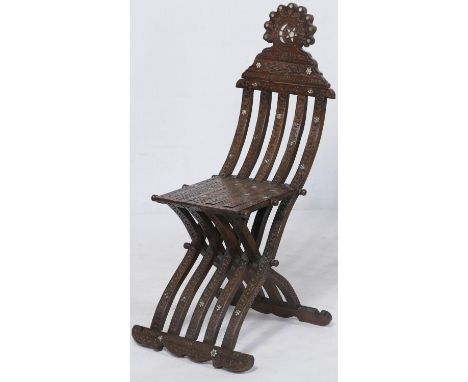 Egyptian carved and mother of pearl inlaid folding cross framed chair, surmounted with an Islamic crescent and star, carved t