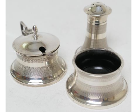 Art Deco silver three piece condiment, Birmingham 1935, comprising pepper pot, salt cellar, wet mustard pot, each with engine