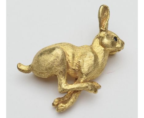 9ct gold running hare brooch, with ruby eyes and textured 'fur', full hallmarks, 34mm, gross weight approx. 8.3g 