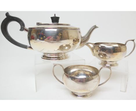 George VI silver three piece tea service, maker G.B &amp; Co., Birmingham 1945/46, plain bun form, the teapot with hinged cov