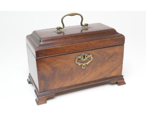 George III mahogany tea caddy, circa 1790, sarcophagus form opening to twin caddies and vacant recess for a mixing bowl, rais