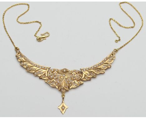 Eastern made yellow gold and pearl necklace, chiselled into a bow form with a triform droplet beneath, the whole suspended fr