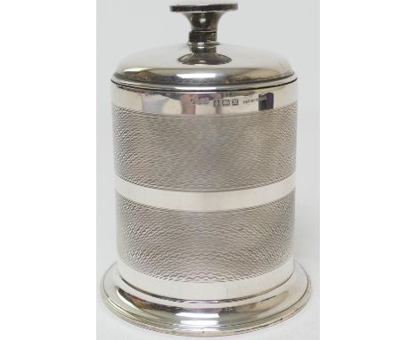 Art Deco silver cigarette dispenser, Birmingham 1936, engine turned cylinder form with rising cover, height 12cm 