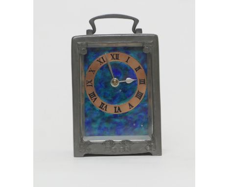 Archibald Knox (1864-1933) for Liberty & Co., a pewter and enamelled carriage clock, the case with stylised ivy leaf details,