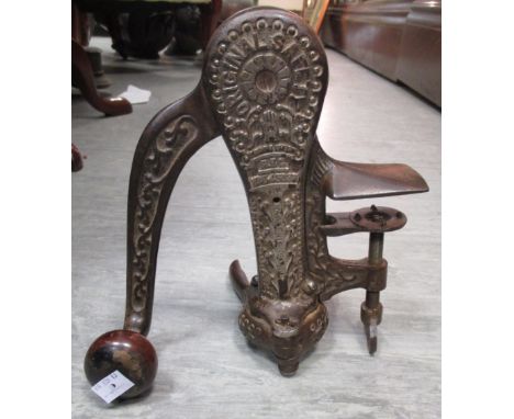 An old bar-top corkscrew with screw clamp, marked 'Original Safely'  