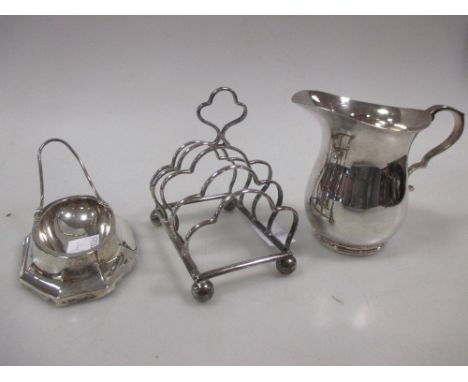 A silver pipe stand, toast rack and creamer  
