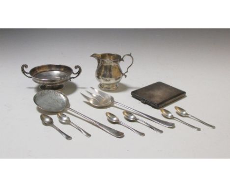 A silver engine turned cigarette case, a silver milk jug, a pair of silver salad servers by Walker & Hall, a set of six coffe