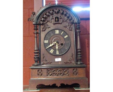 A 19th Century Austrian oak cased cuckoo mantel clock  