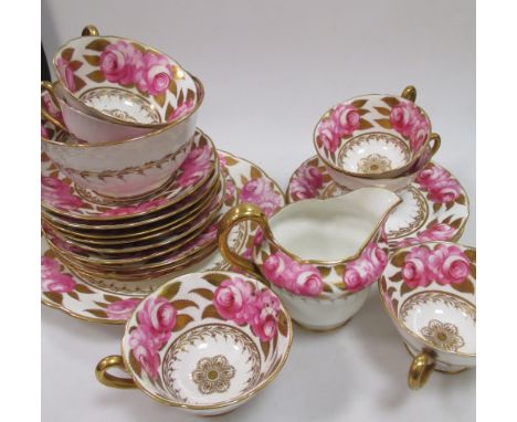 A part early 19th century English porcelain part tea service, retailed by Goode & Co, decorated with pink floral spray  