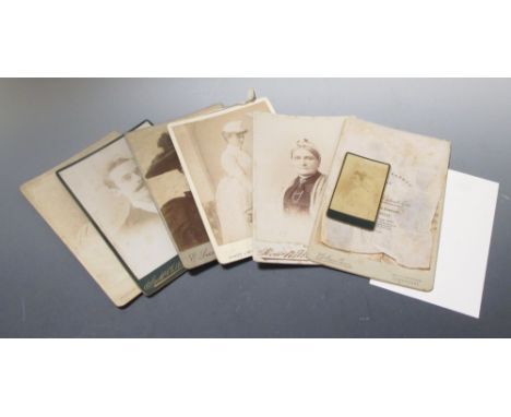 An 'Army and Navy' photograph album circa 1895, some leaves with coloured illustrations after Caton Woodville, and a few inse